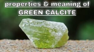 Green calcite crystal with informative caption.